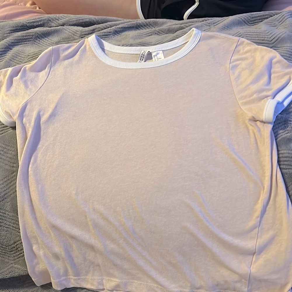 Selling this pink light cream cop top / shirt M and good condition no stains